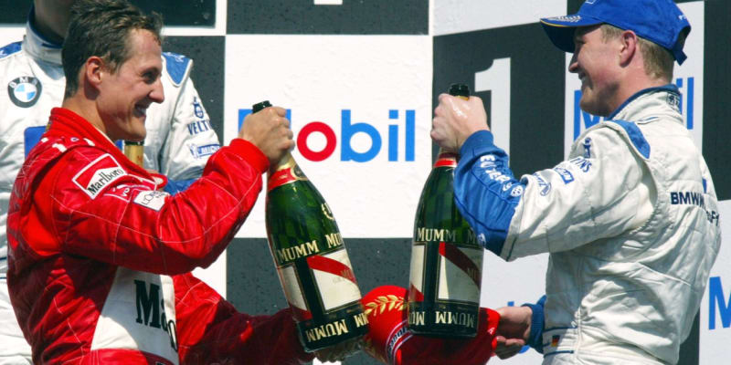 Michael Schumacher a Ralf Schumacher stupně a šampaňské