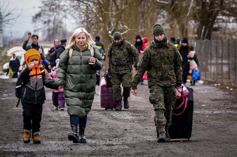 Uprchlíci z Ukrajiny na hraničním přechodu Medyka