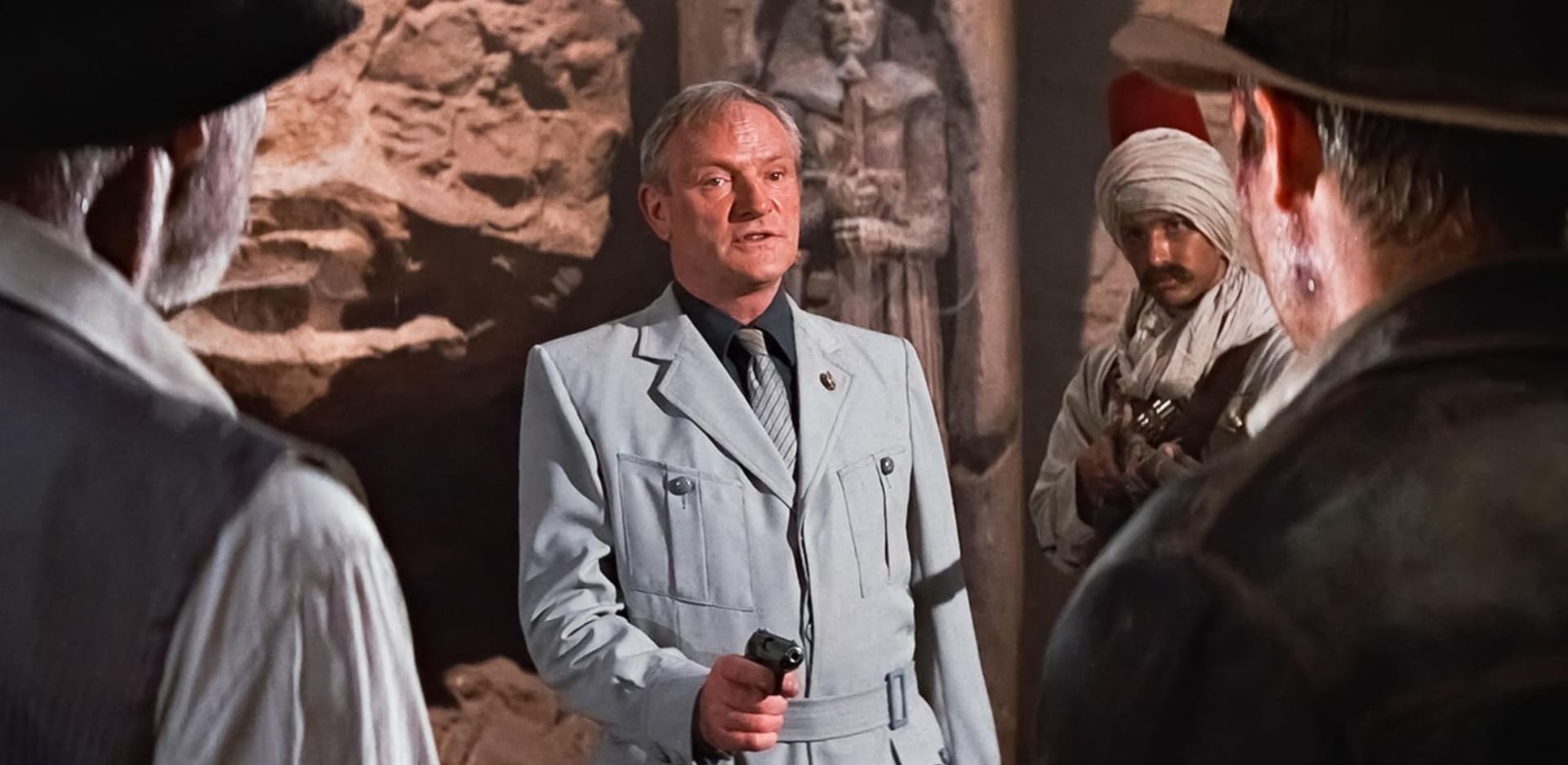Jednou z nejvýznamnějších rolí byl pro Glovera (uprostřed) Walter Donovan, hlavní záporák filmu Indiana Jones a poslední křížová výprava. Zde si zahrál po boku Harrisona Forda i Seana Conneryho.