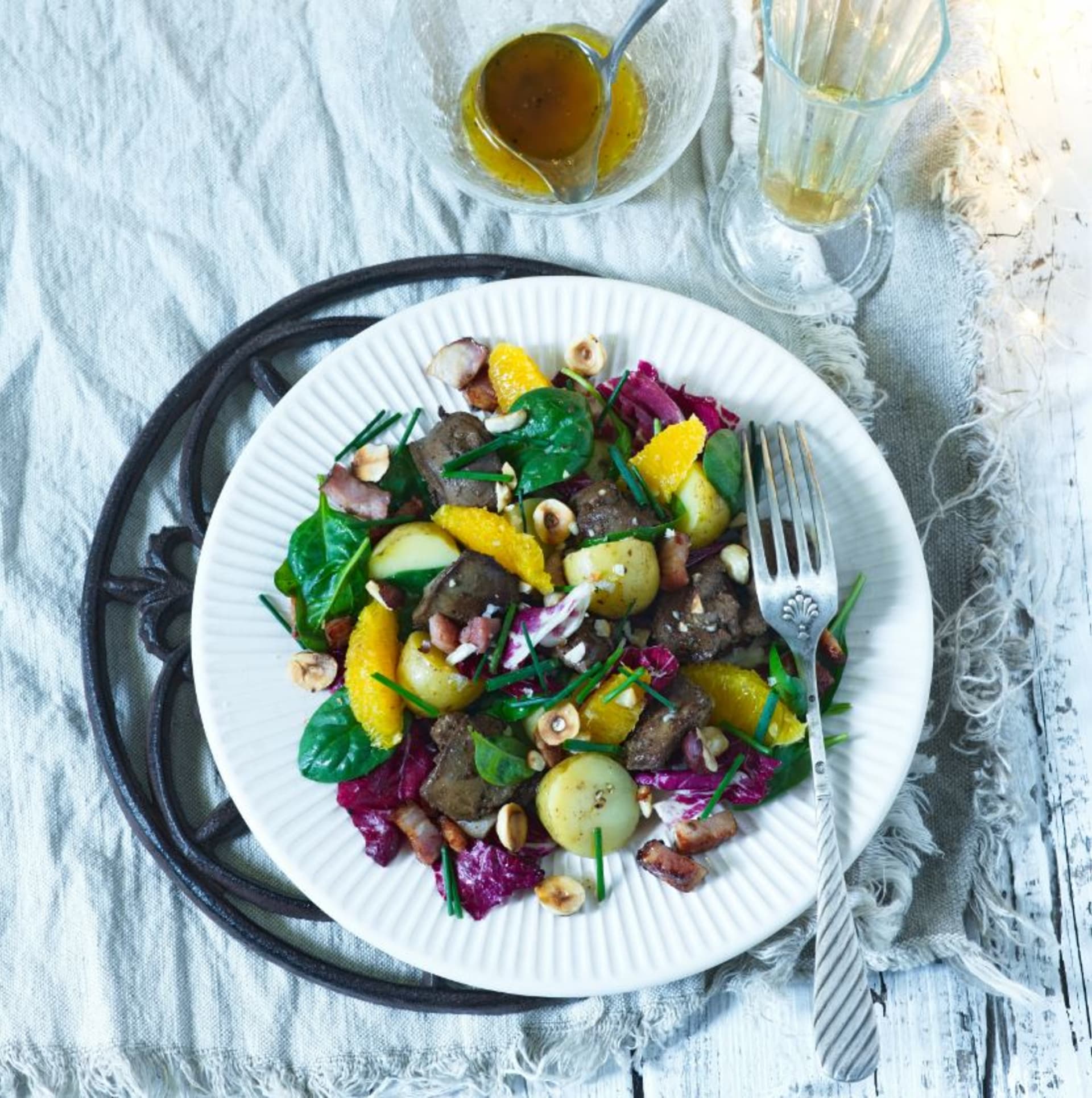 Treasure of French cuisine: Salad for a festive lunch with chicken livers and orange