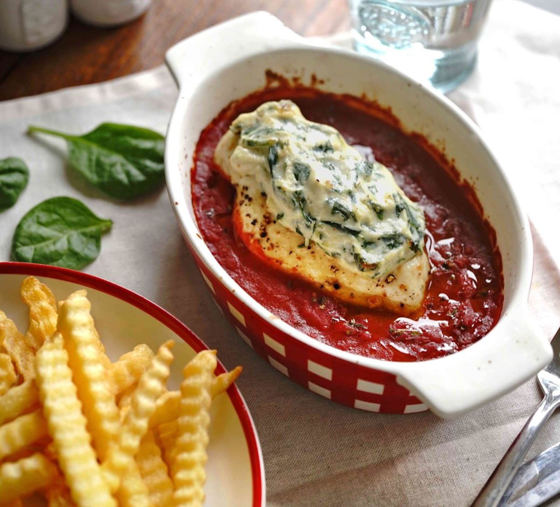 Chicken breast with spinach and ricotta filling and French fries 