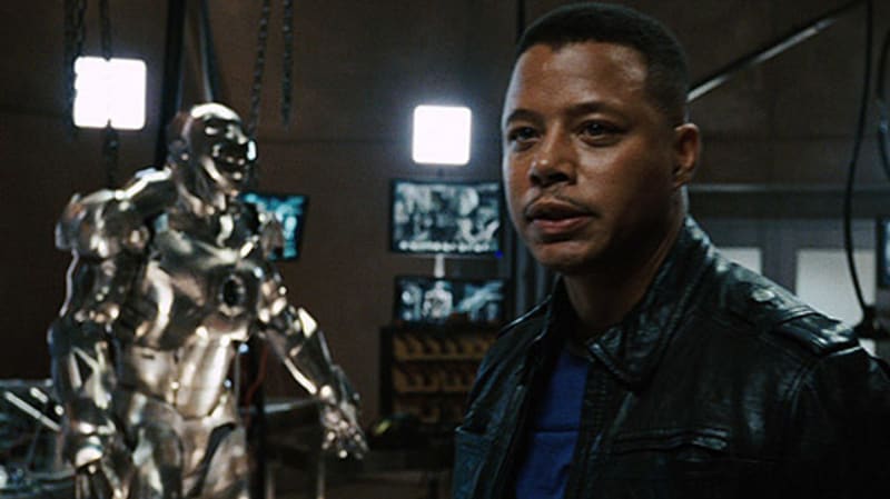 Když v prvním Iron Manovi Tony Stark před finále odletí ze svého hangáru, nechá v něm Rhodeyho samotného. Ten se s chutí podívá na oblek War Machine, ale nakonec tu myšlenku odhodí se slovy "Příště, bejby." V dalších filmech už oblek navlékne.